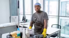medium-shot-man-with-cleaning-cart_23-2149345518